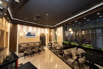 a restaurant with tables and chairs and a bar at Fama Karaköy in Istanbul