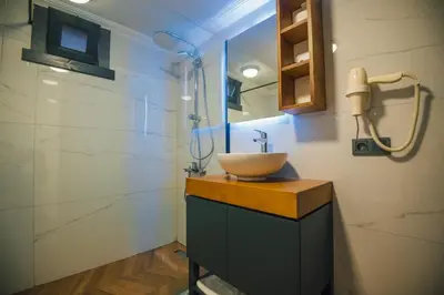 a bathroom with a bowl sink and a shower at Woodlodge Country Sapanca in Sapanca