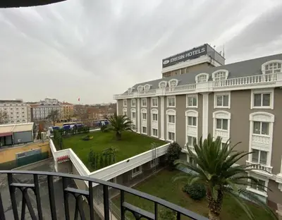 a large white building with a courtyard in front of it at Eresin Hotels Express in Istanbul