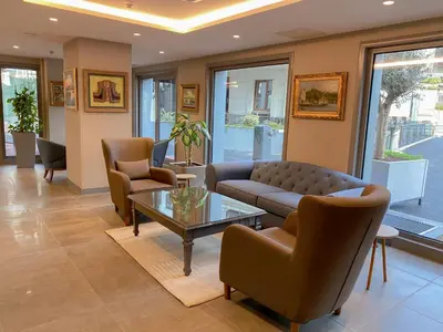 a living room with a couch and chairs and a table at Eresin Hotels Express in Istanbul