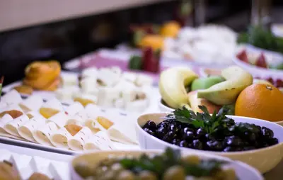 a buffet with bowls of fruit on a table at Ak residence in Istanbul