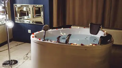 a bath tub with christmas lights in a bathroom at Mas Suites Karaköy in Istanbul