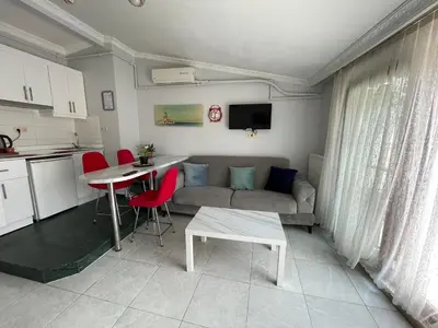 a living room with a couch and a table at Asteria House in Istanbul