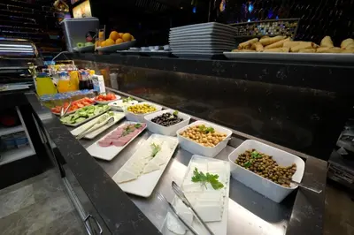 a buffet line with different types of food on display at Celine Hotel Taxim in Istanbul
