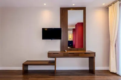 a dressing table with a mirror and a tv at Istanbul Old City Topkapi Porta Romanos Hotel Ottoman Heritage in Istanbul