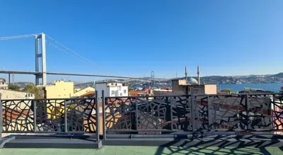 a view of the golden gate bridge from a balcony at Dilens Bosphorus Hotel in Istanbul