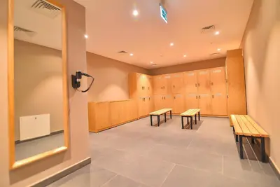 a waiting room with benches and lockers at SERENİTY COMFORT Hotel in Istanbul