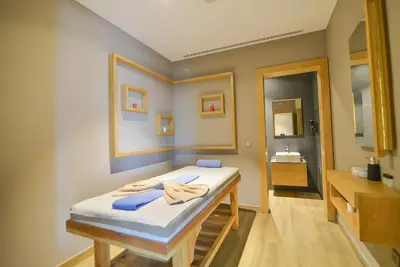 a room with a bed and a bathroom with a sink at SERENİTY COMFORT Hotel in Istanbul