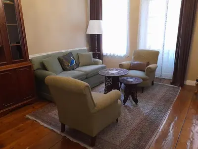 a living room with a couch and chairs and a table at Agus Flats Galata in Istanbul