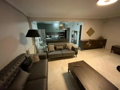 a living room with a couch and a table at Luxury Z-Apart Family Homes 2 Bedrooms WIFI near Metro Zeytinburnu Istanbul in Istanbul