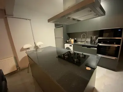a kitchen with a black counter top and a stove at Luxury Z-Apart Family Homes 2 Bedrooms WIFI near Metro Zeytinburnu Istanbul in Istanbul