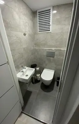 a bathroom with a toilet and a sink at Luxury Z-Apart Family Homes 2 Bedrooms WIFI near Metro Zeytinburnu Istanbul in Istanbul