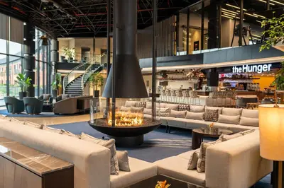 a lobby of a hotel with couches and a bar at Crowne Plaza Istanbul Tuzla Viaport Marina by IHG in Istanbul