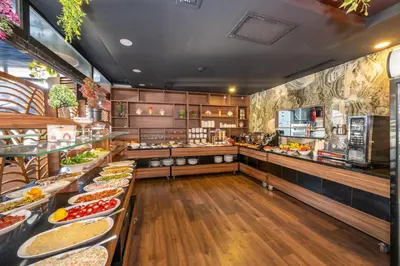 a buffet line with many plates of food at Litros Hotel & Spa in Istanbul