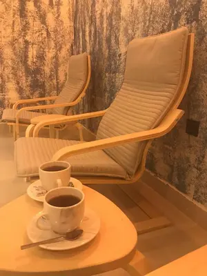 two chairs and two cups of coffee on a table at Seyithan Palace Spa Hotel in Istanbul