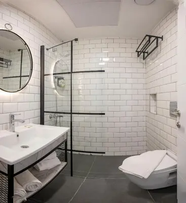 a bathroom with a sink and a toilet and a shower at Seyithan Palace Spa Hotel in Istanbul