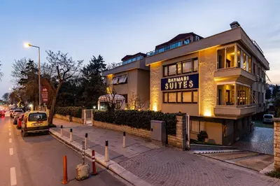 a building on a street with a car parked in front at BayMari Suites Plus Florya in Istanbul