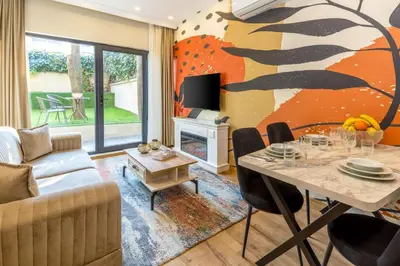 a living room with a couch and a table at BayMari Suites Plus Florya in Istanbul