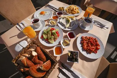 a table with many plates of food on it at Stargate Hotel&Spa in Korfez