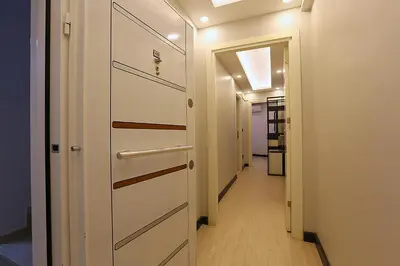 a hallway with a white door and a hallway with a hallway at Galata King Suites in Istanbul