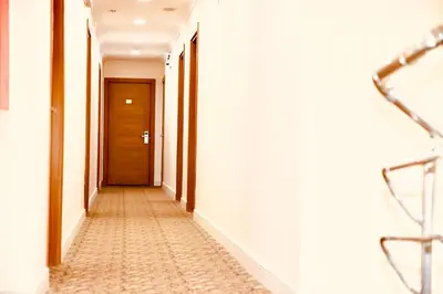 an empty corridor with a door in a building at Miletus Otel Şile in Sile