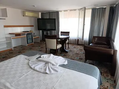 a hotel room with a bed with a towel on it at Şirin Hotel in Istanbul