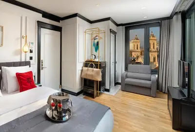 a hotel room with a bed and a chair at The Trinity Hotel Taksim - Special Category in Istanbul