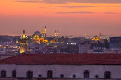 a view of a city at sunset with mosques at The Trinity Hotel Taksim - Special Category in Istanbul