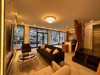 a living room with a couch and a table at KA Hotel & Suites in Istanbul