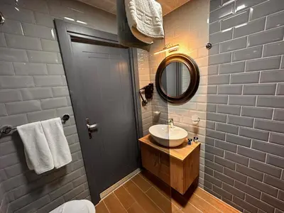a bathroom with a sink and a mirror at KA Hotel & Suites in Istanbul