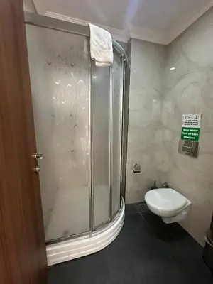 a bathroom with a shower and a toilet at Hotel La SERA in Istanbul