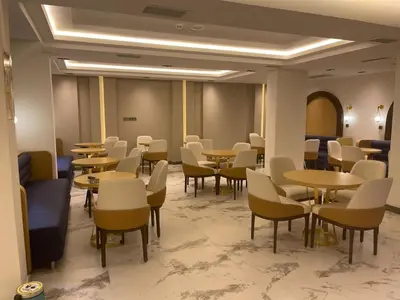 a waiting room with tables and chairs in a building at The Biancho Hotel Old City - Special Category in Istanbul