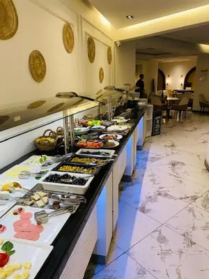a buffet line with many different types of food at The Biancho Hotel Old City - Special Category in Istanbul