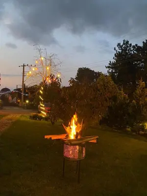a fire pit in a yard at night at SNOW HİLL HOUSE Pansiyon in Kartepe