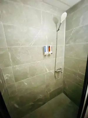 a shower with a shower head in a bathroom at Airport Best Hotel in Istanbul