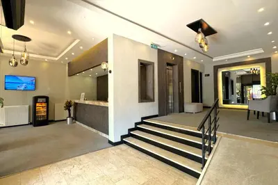 a lobby with a staircase in a house at Tekirdağ Yat Hotel in Tekirdag