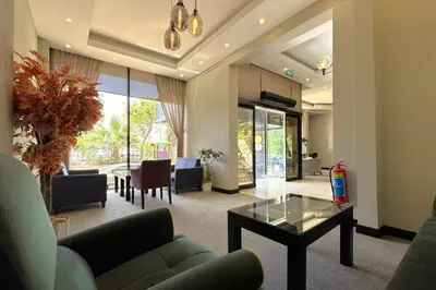 a living room with a couch and a table at Tekirdağ Yat Hotel in Tekirdag