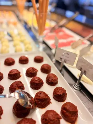 a tray of brownie cookies on a table with spoons at Tekirdağ Yat Hotel in Tekirdag