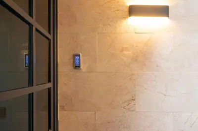a bathroom with a stone wall with a light on it at Taxim Sunpera Suites in Istanbul