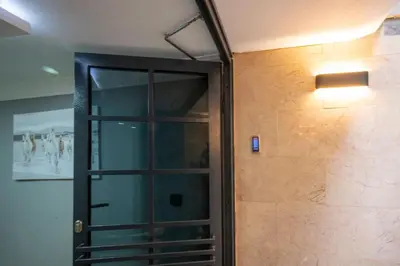 a glass door in a wall with a light on it at Taxim Sunpera Suites in Istanbul