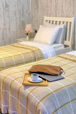 two beds with a tray with a coffee cup and a purse at World DREAMS Sapanca in Sakarya