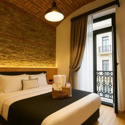 a bedroom with a large bed and a window at Taksim Istiklal Street Kamilbey Hotel in Istanbul