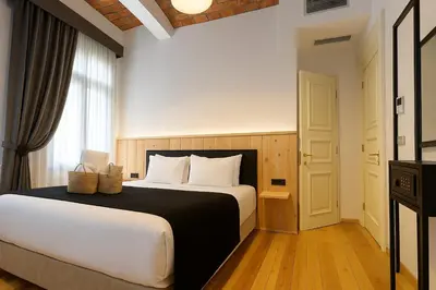 a bedroom with a large bed and a window at Taksim Istiklal Street Kamilbey Hotel in Istanbul