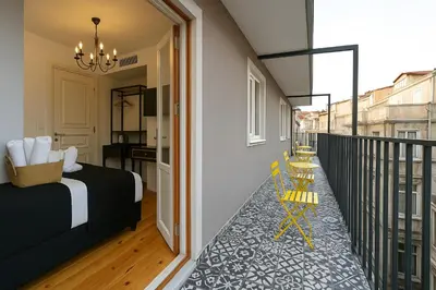 a bedroom with a bed and a balcony at Taksim Istiklal Street Kamilbey Hotel in Istanbul