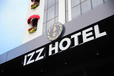 a hilton sign on the side of a building at İzz Hotel Koşuyolu in Istanbul