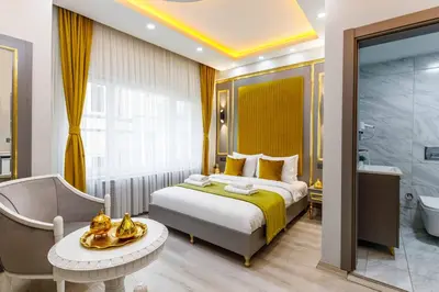 a hotel room with a bed and a bathroom at Santa Rio Taxim in Istanbul