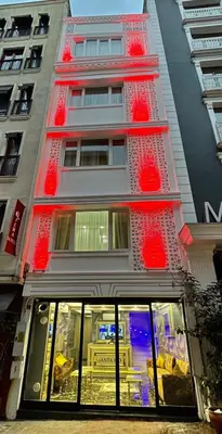 a building with red decorations on the side of it at Santa Rio Taxim in Istanbul