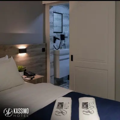 a bedroom with a bed with two pillows on it at Kassimo Hotel in Istanbul