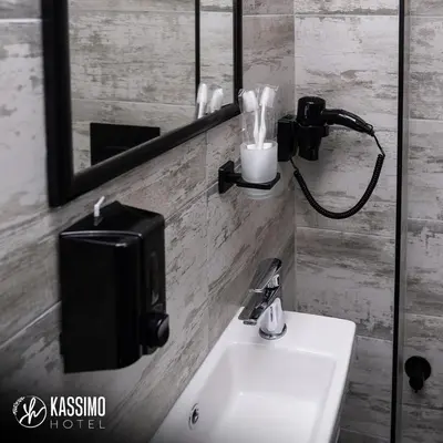 a bathroom with a sink and a mirror at Kassimo Hotel in Istanbul