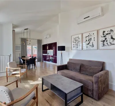 a living room with a couch and a table at Casa Di Bava Suites by TCH in Istanbul